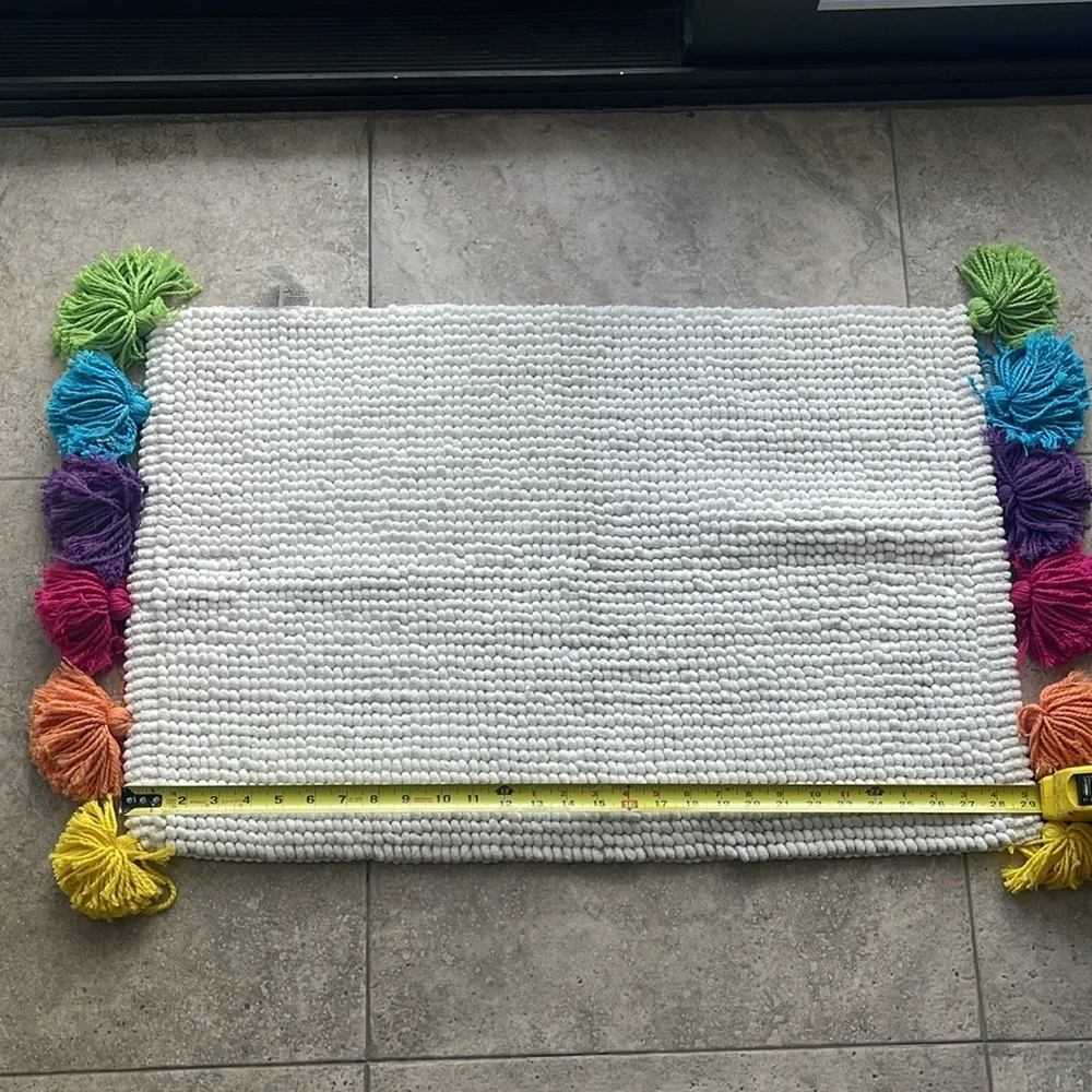 Pom Pom floor mat. NWOT. Never used. Non smoker home.